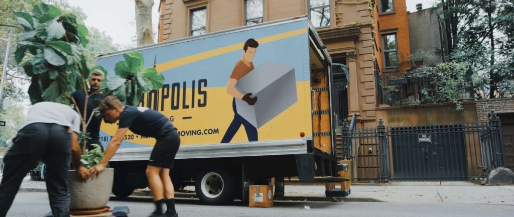 Photo of a a moving truck with boxes being delivered