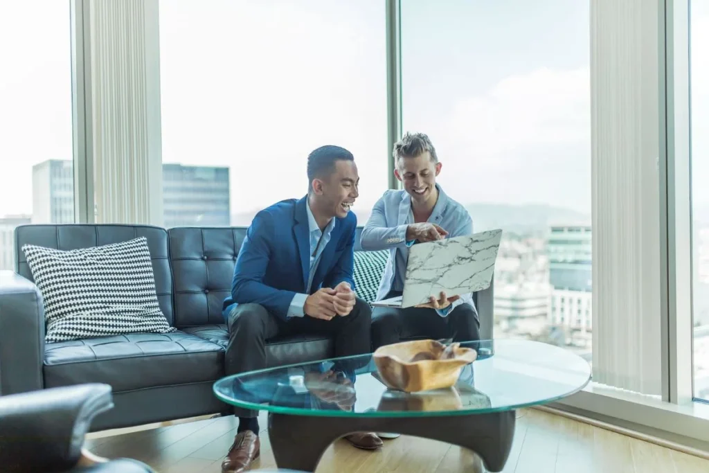 Two-Men-Looking-at-their-Laptop