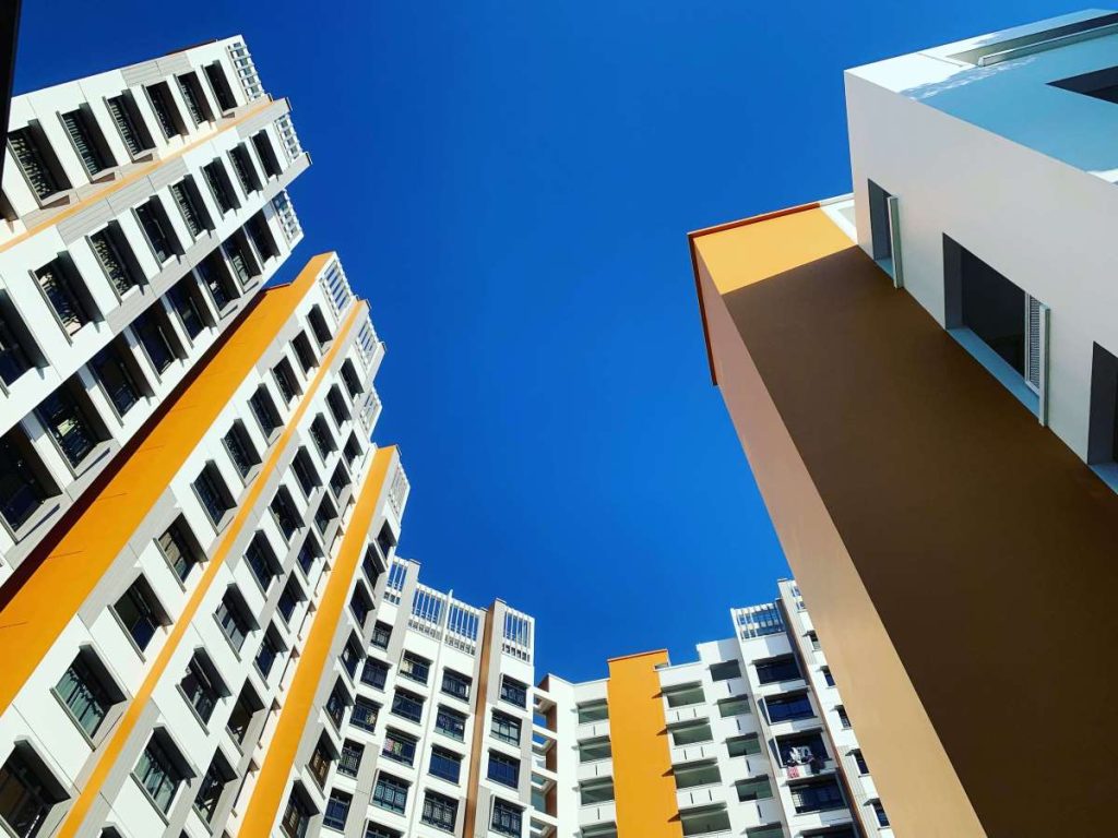 a worms eyeview photo of condo buildings