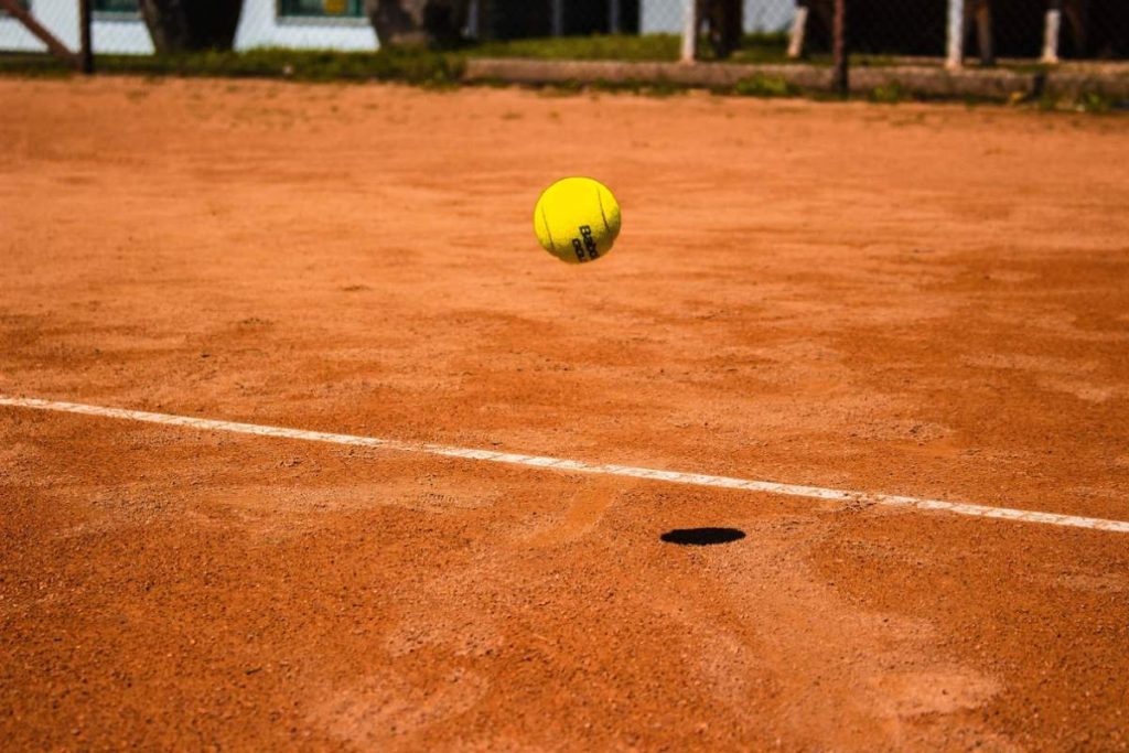 photo of a bouncing tennis ball