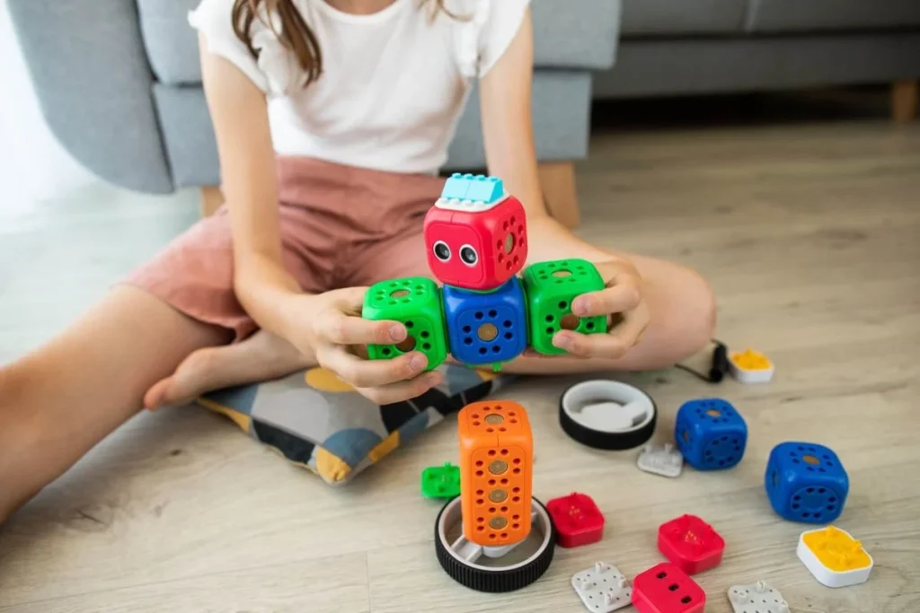 photo of a child playing with her toys