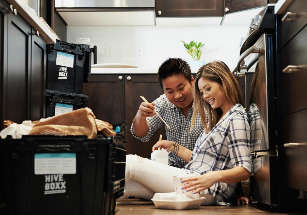 photo of a couple enjoying their dinner in the kitchen