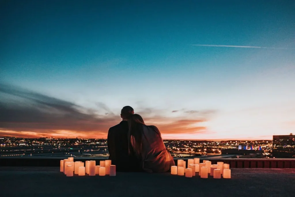 photo of a couple inside of a candle-lit circle