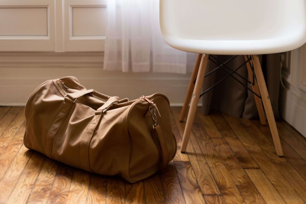 photo of a duffle bag on the floor