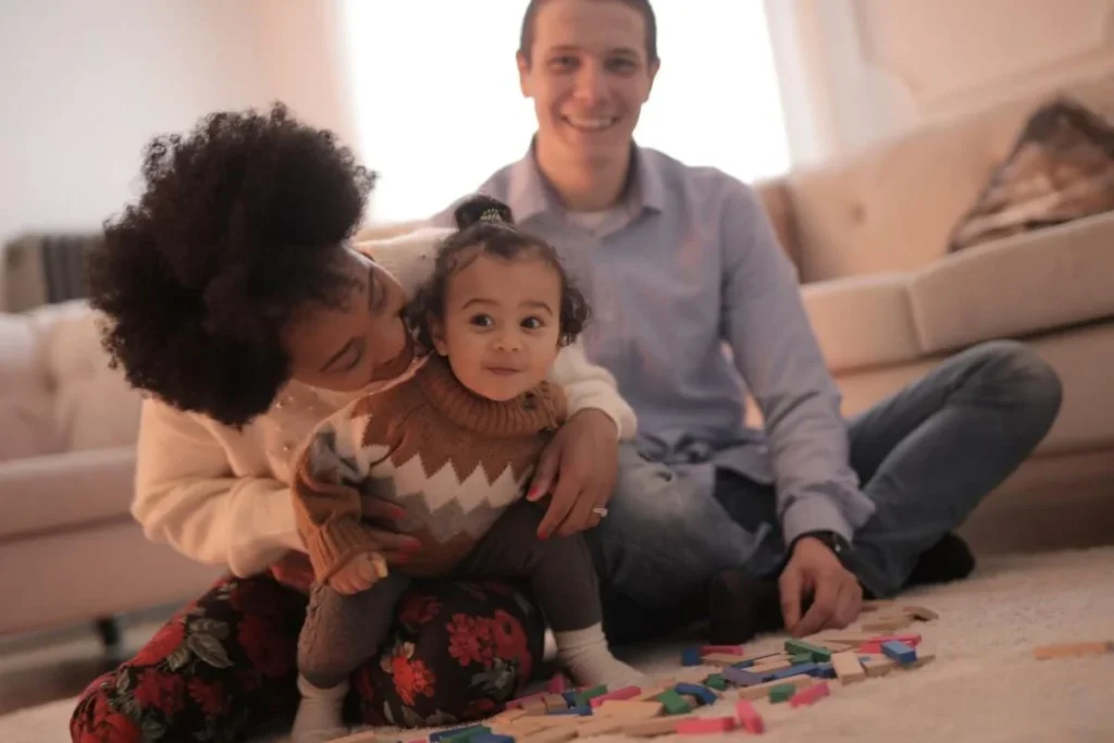 photo of a family playing in the living room