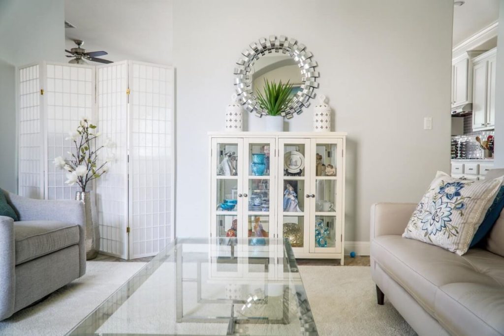 photo of a living room with a display cabinet