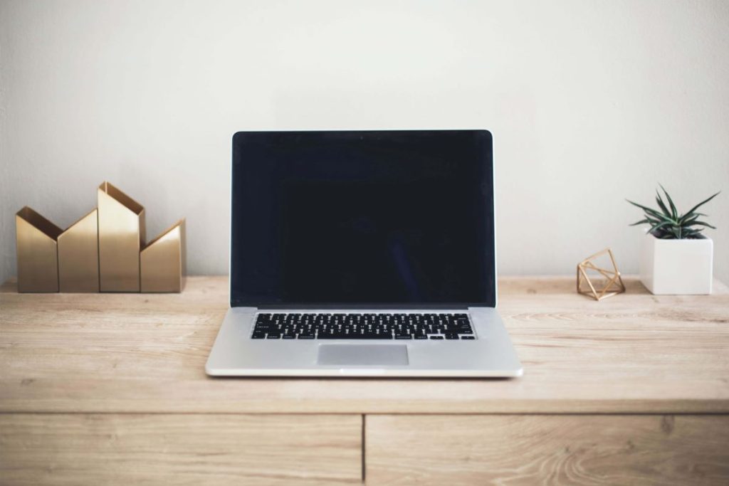 photo of a macbook on a desk