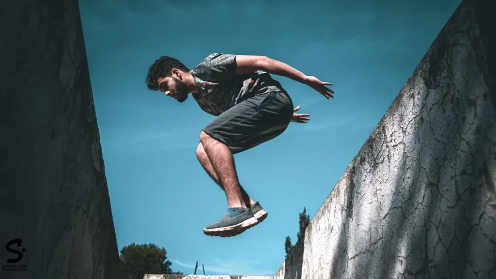 photo of a man doing Parkour