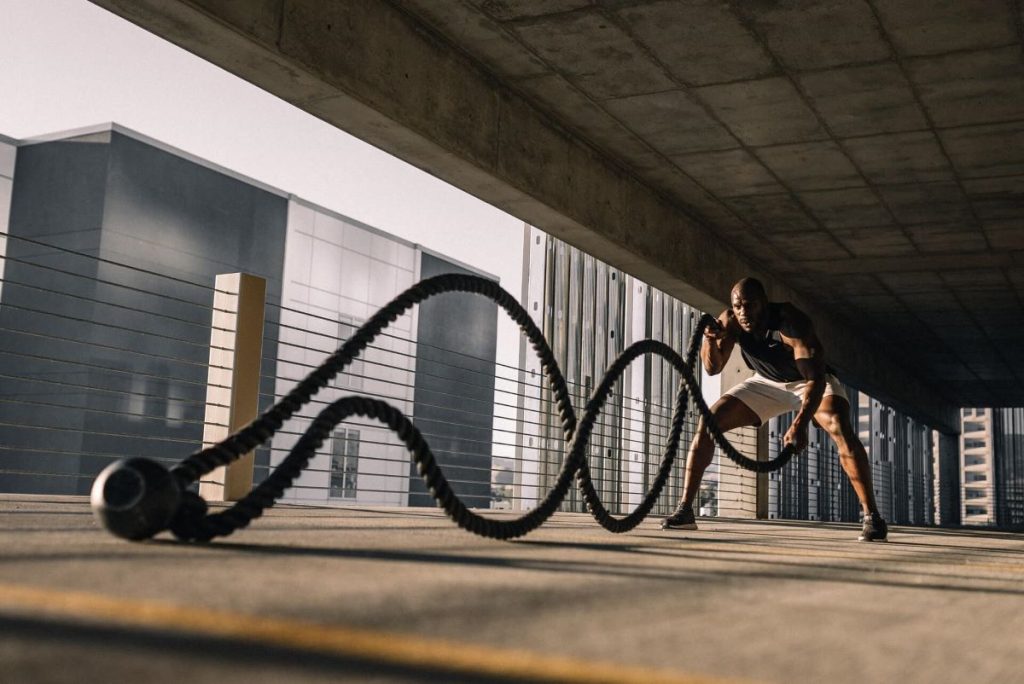 photo of a man doing rope exercises