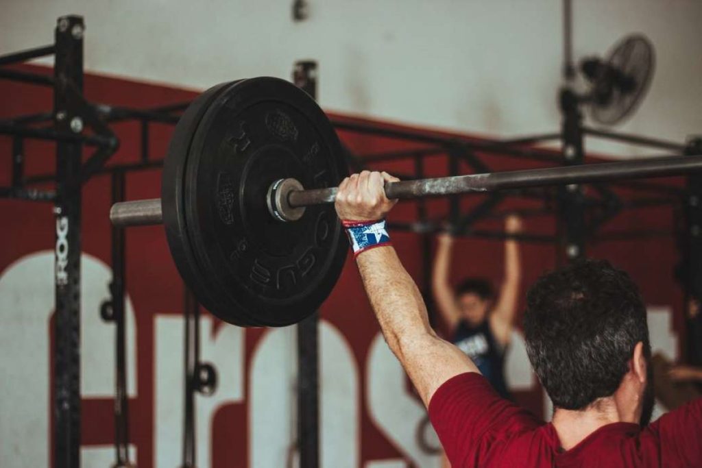 photo of a man doing weightlifting