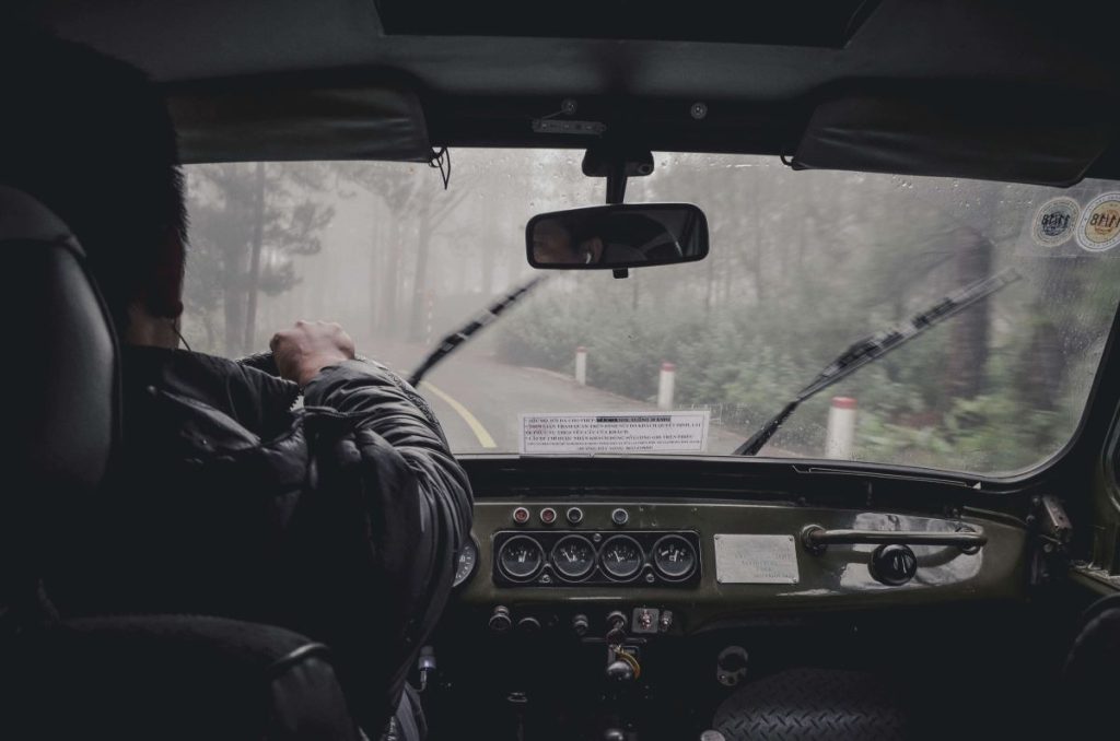 photo of a man driving