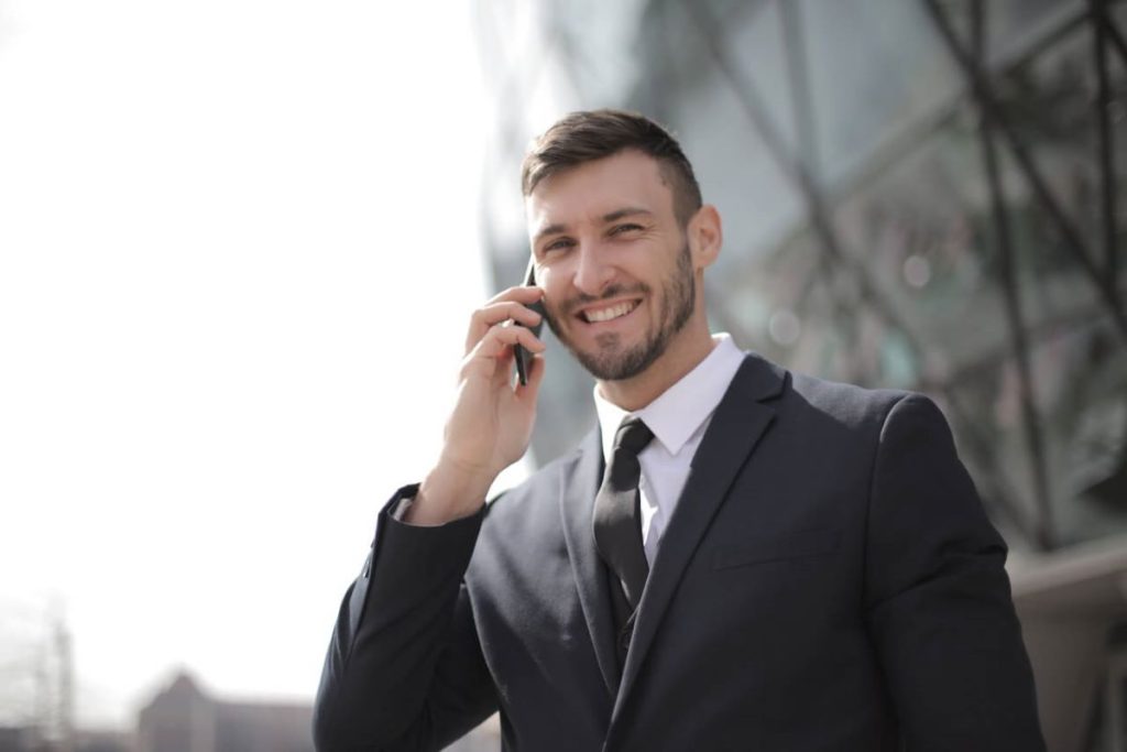 photo of a man speaking to someone on the phone