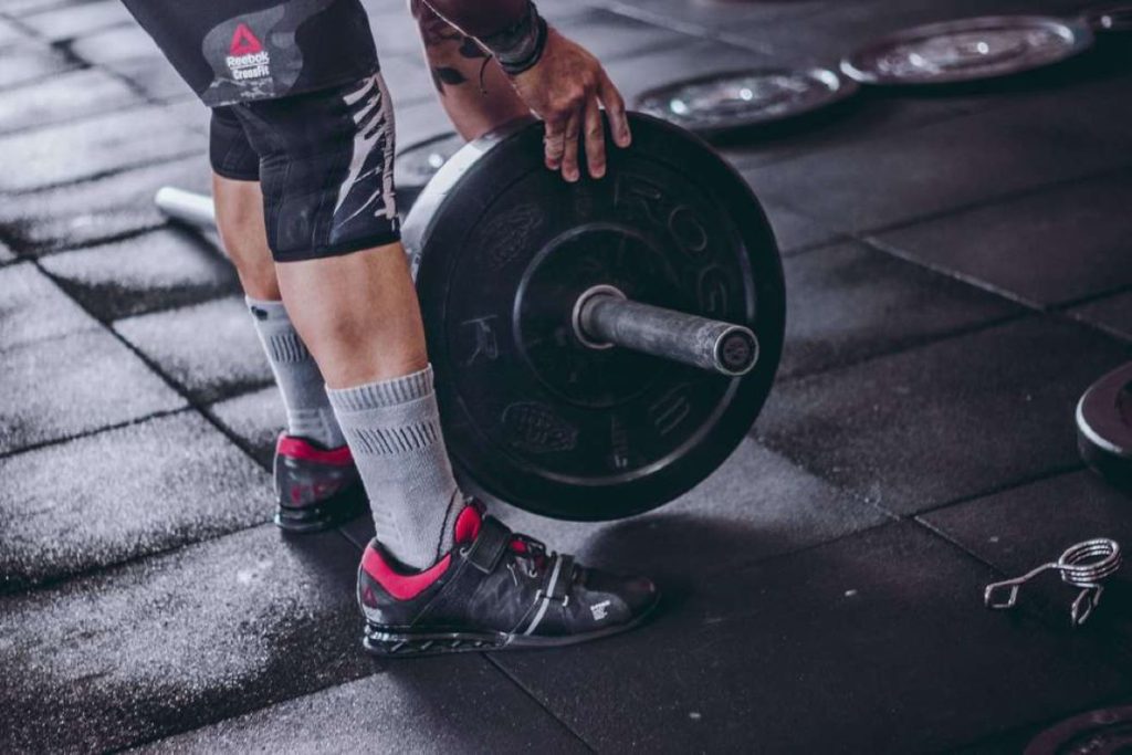 photo of a person adding weights