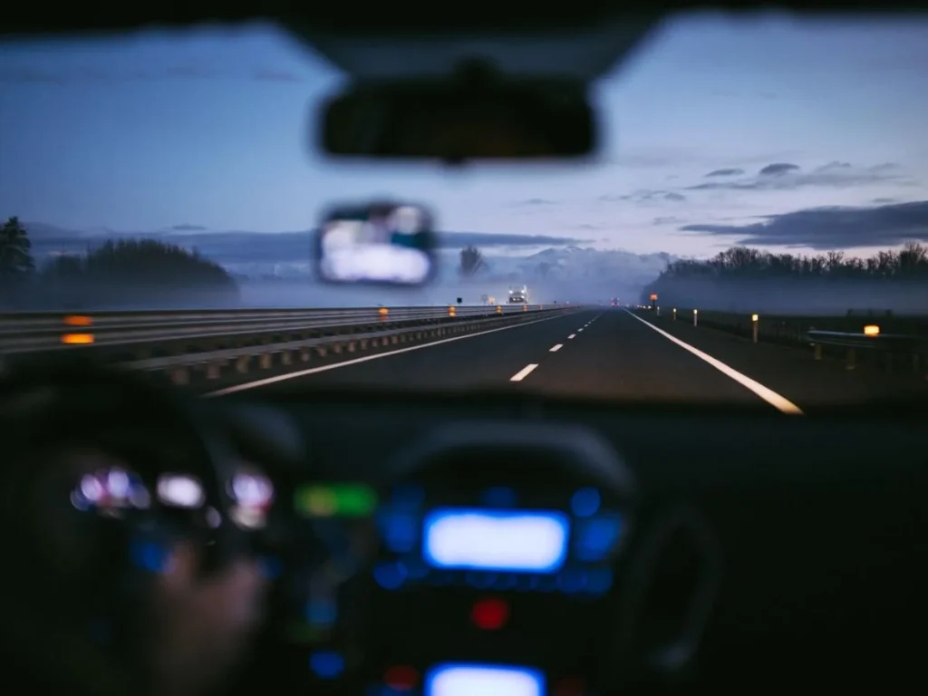 photo of a person driving in the highway