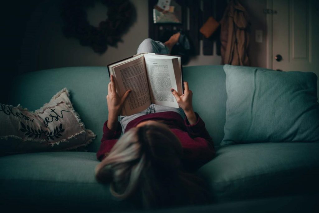 photo of a person reading a book