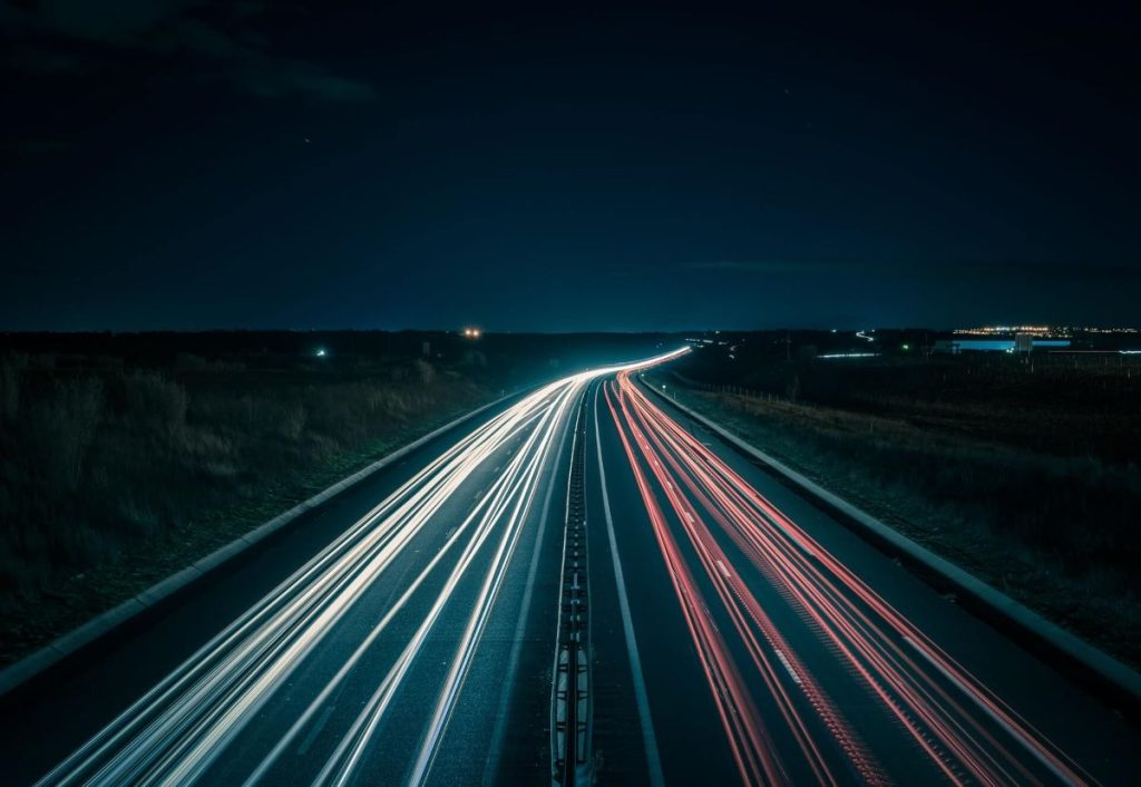 photo of a road with light trail