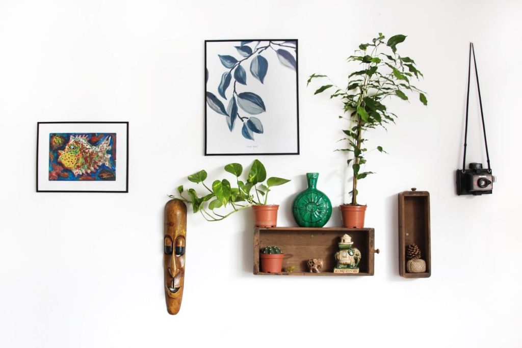 photo of a wall with a decorative shelf and other decorations