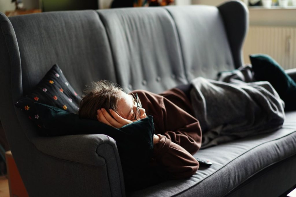 photo of a woman lying on a couch