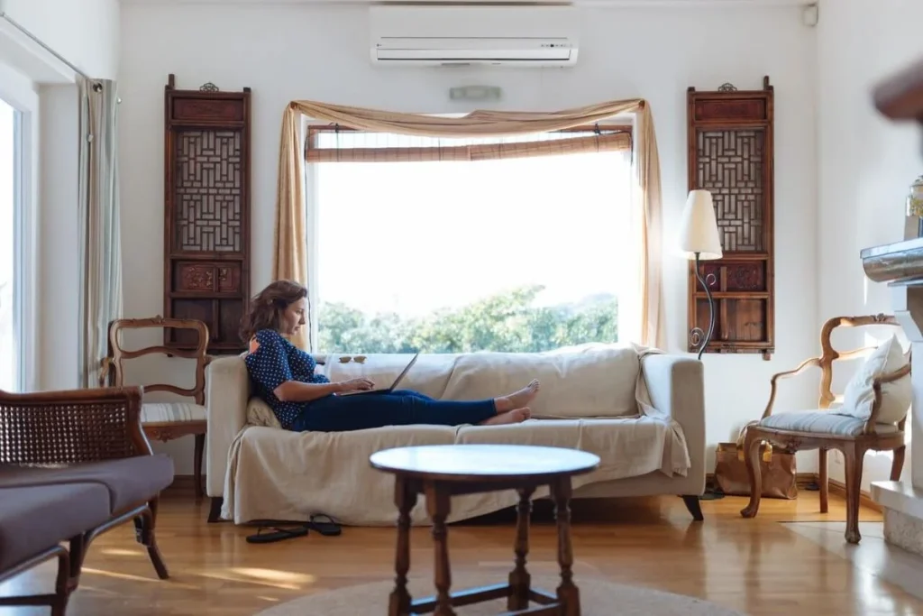 photo of a woman settled in her living room