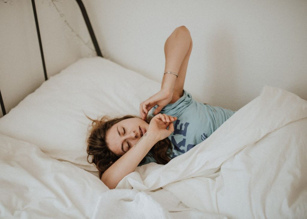 photo of a woman sleeping bed