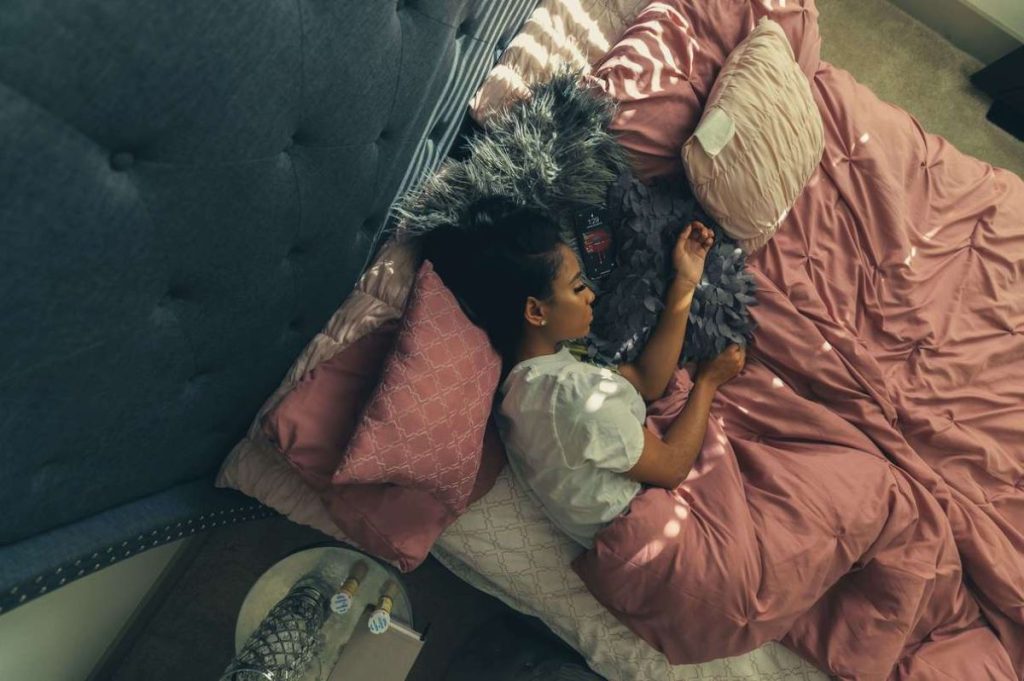 photo of a woman sleeping in bed