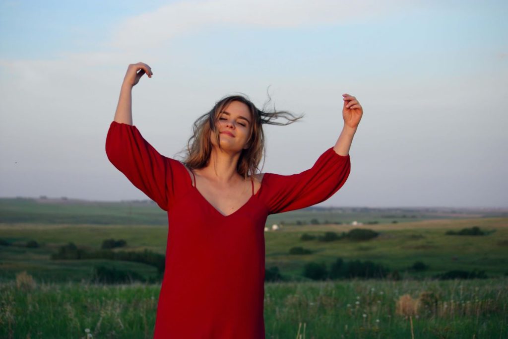 photo of a woman wearing a red dress