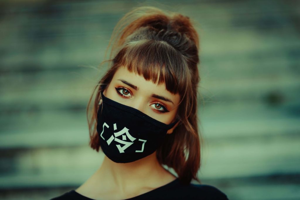 photo of a young woman wearing a styled face mask