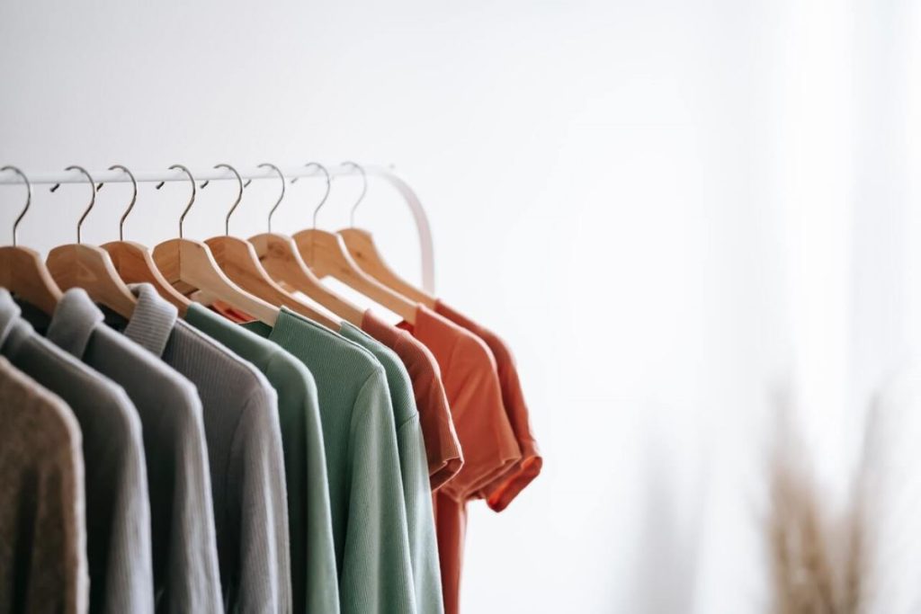 photo of an assorted color of shirts in hangers