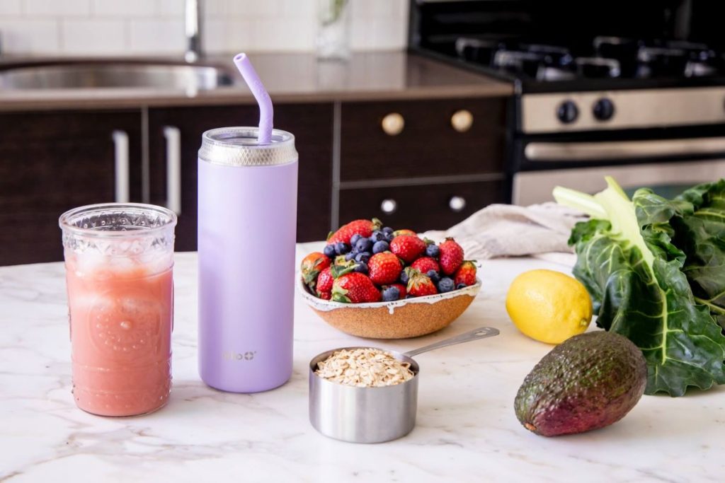 photo of homemade smoothies on a counter with fruits