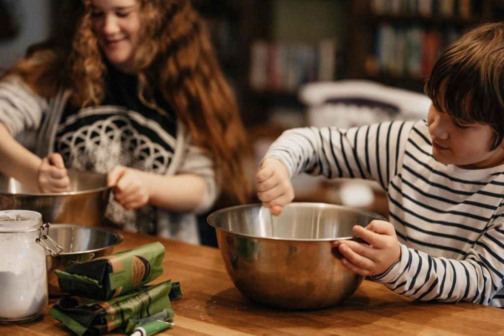 photo of siblings baking