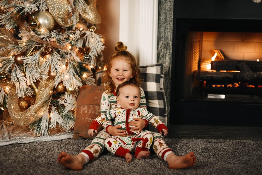photo of siblings dressed in their christmas jumpers