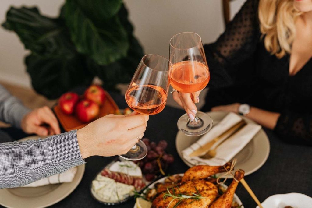 photo of two people toasting in lunch