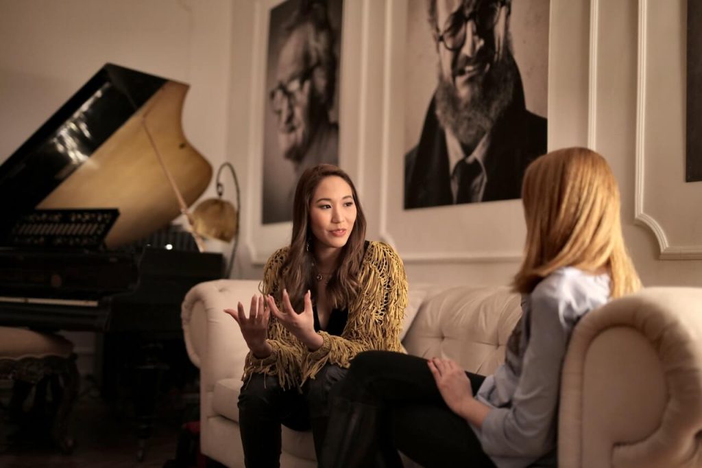 photo of two women in conversation