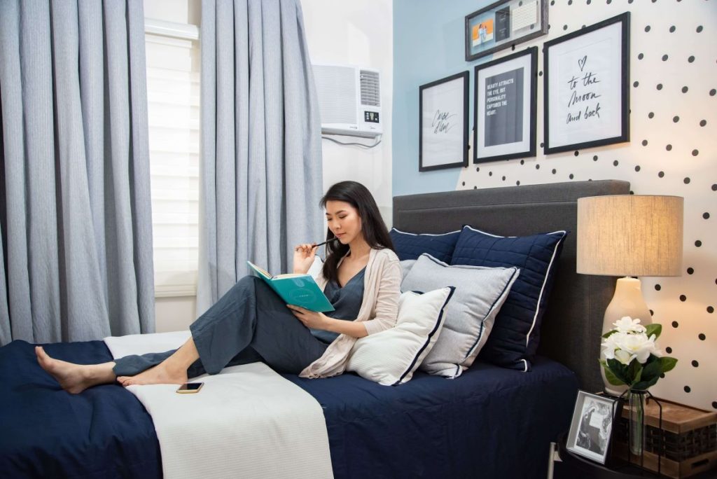 photo of woman relaxing in bed