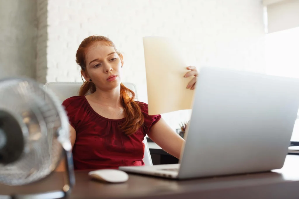 A Woman Sweating while sitting down A-Woman-Sweating-while-sitting-down