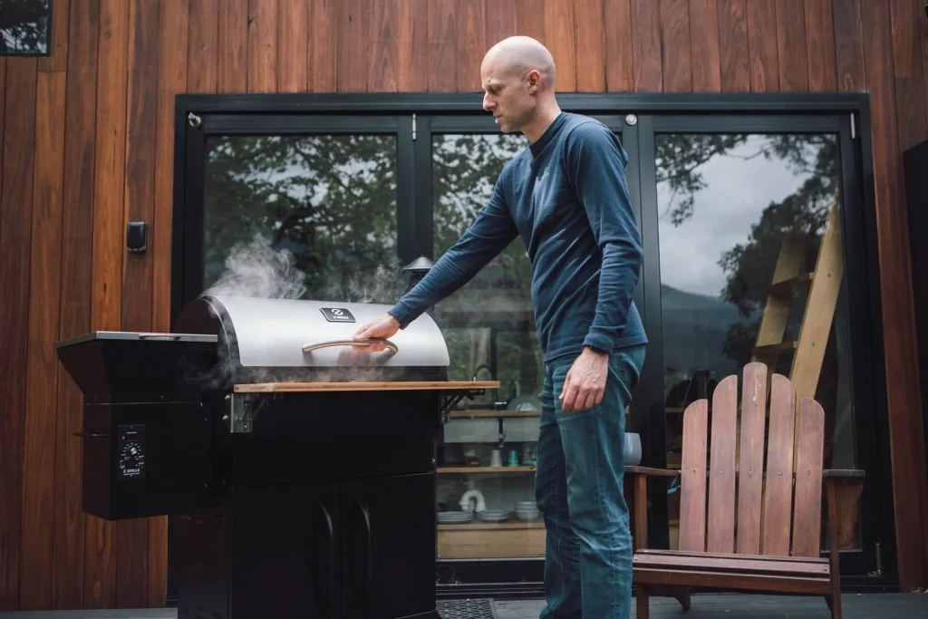 Man opening a grill Man-opening-a-grill