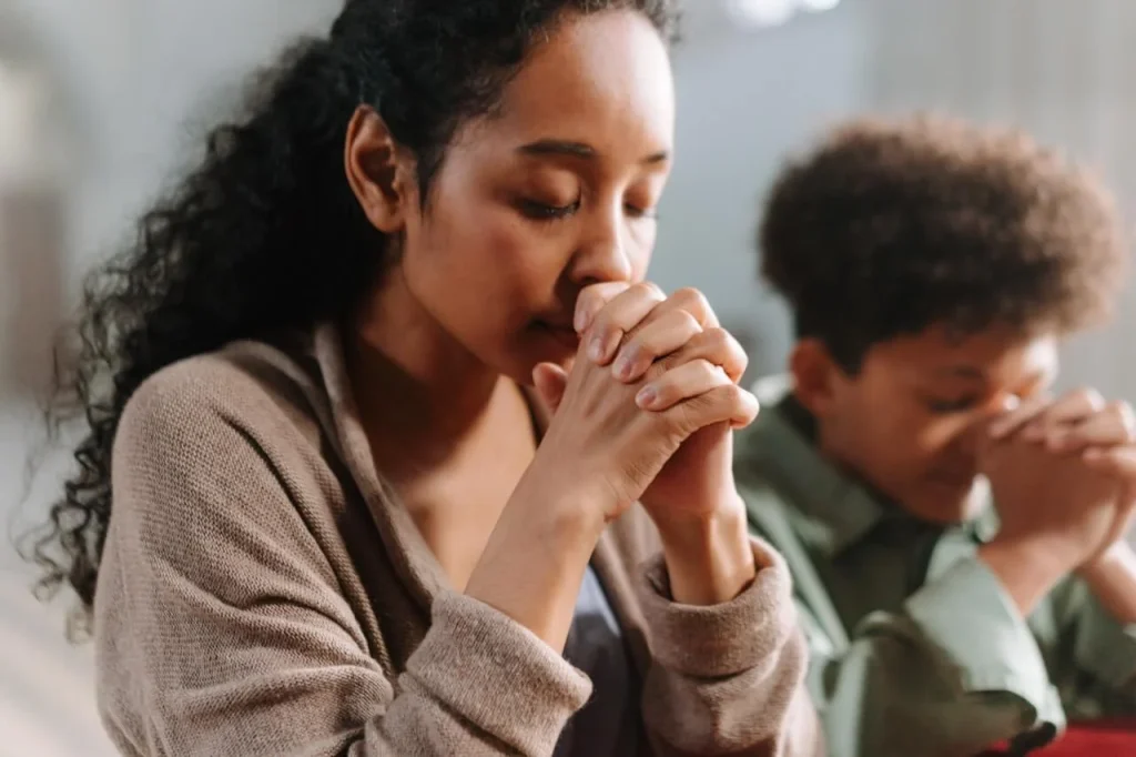 Mother and son praying Mother-and-son-praying