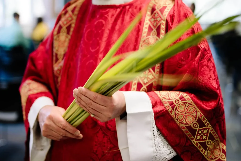 Priest-holding-palm-leaves