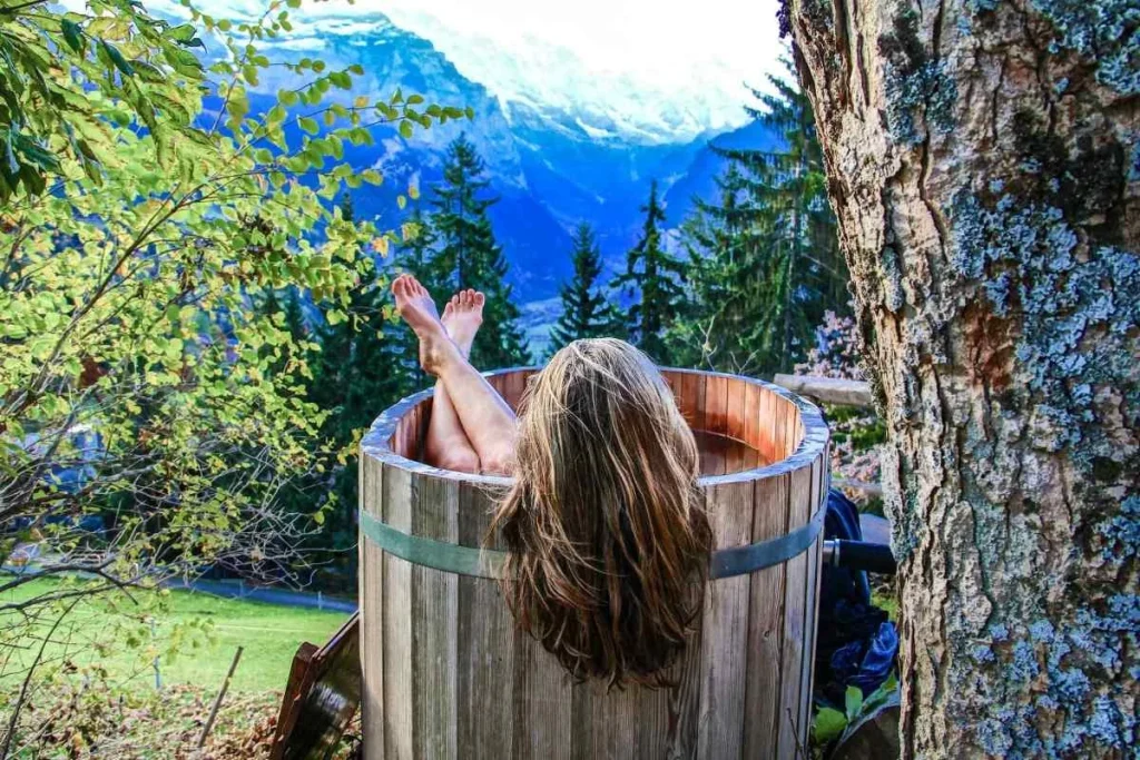 Woman-in-a-wooden-hot-tub-outside