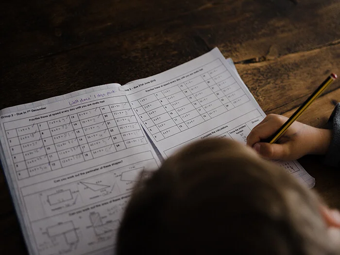 photo of a kid doing their homework