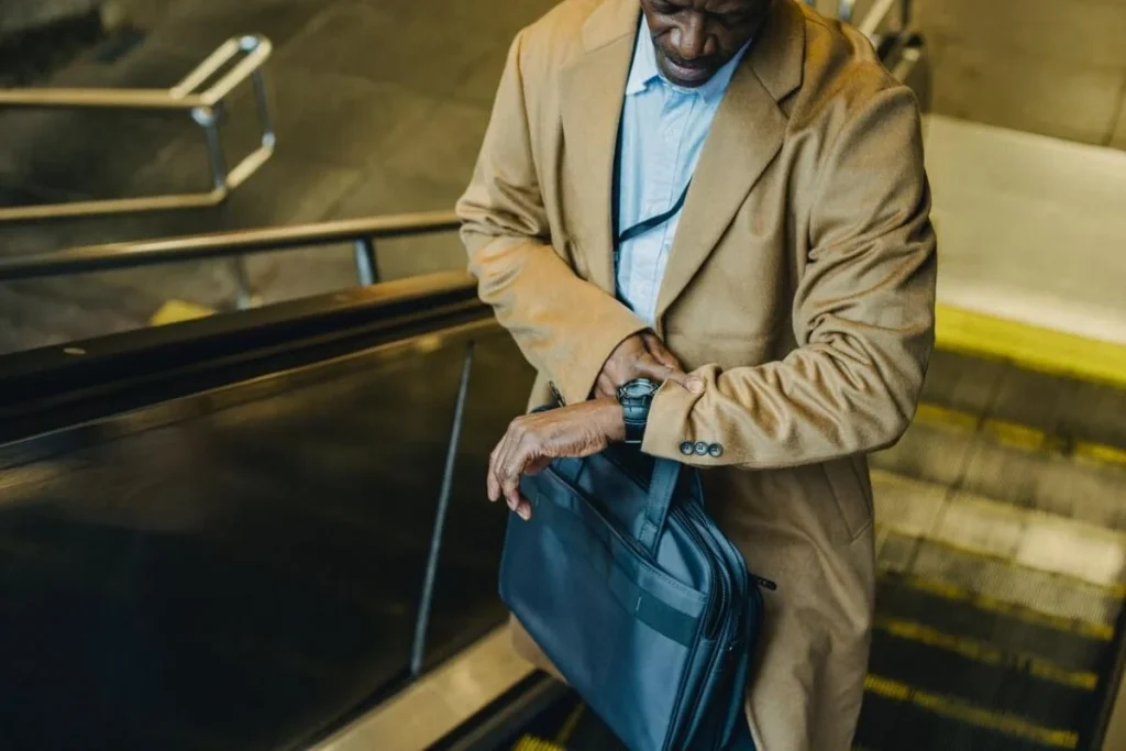 photo of a man checking his watch