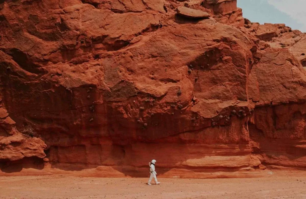 photo of a man walking on mars