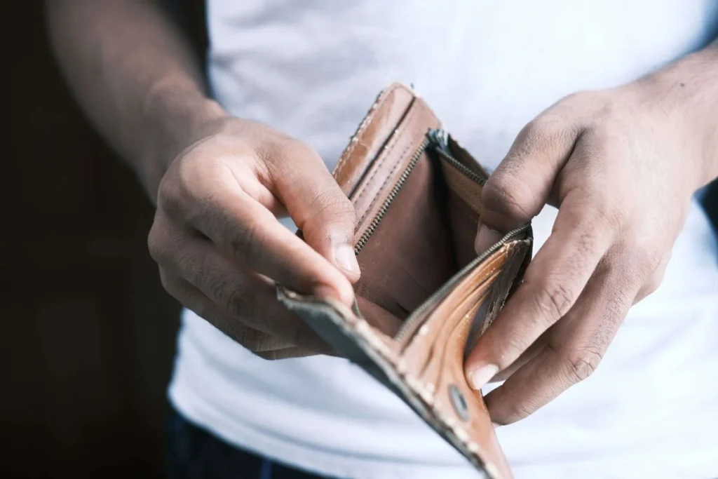 photo of a man with an empty wallet