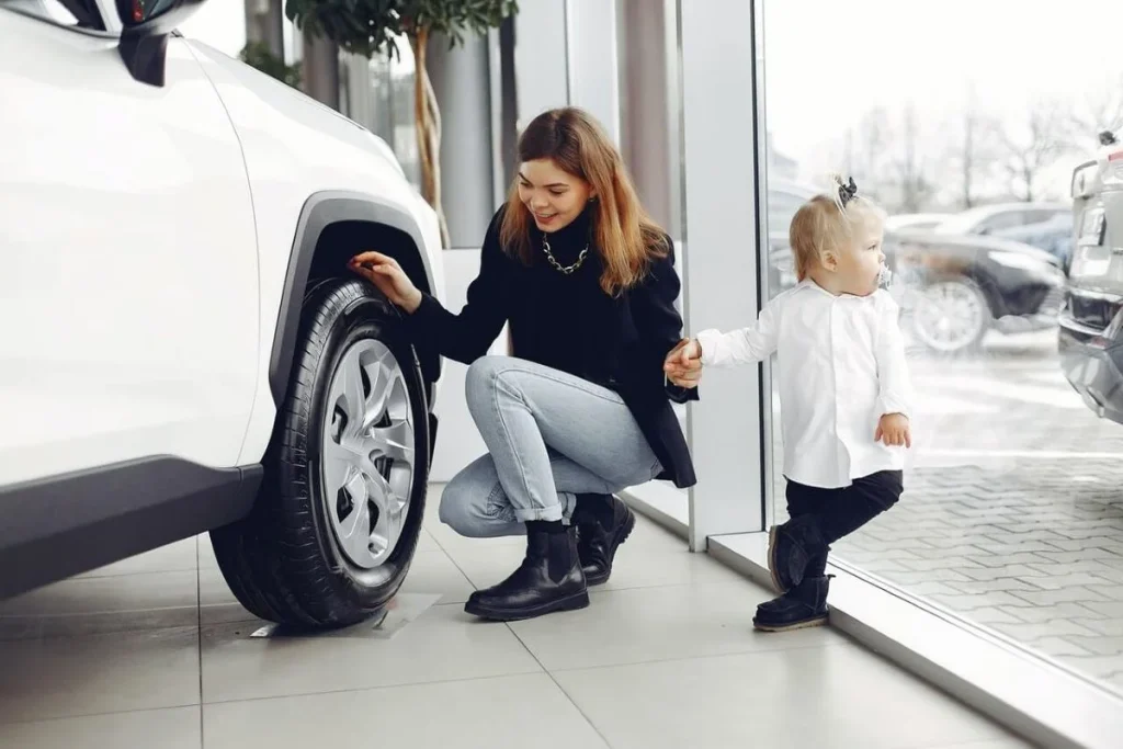 photo of a mother and child looking for a new car