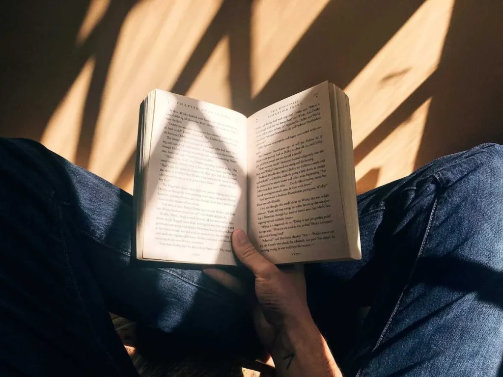 photo of a person reading a book