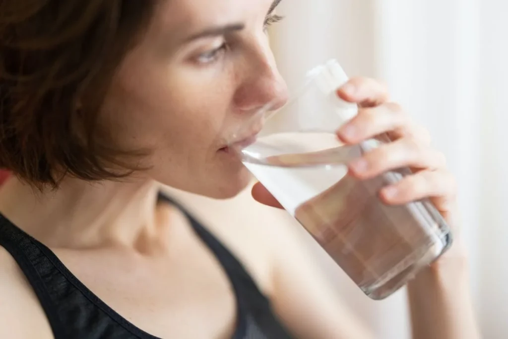 photo of a woman drinking water