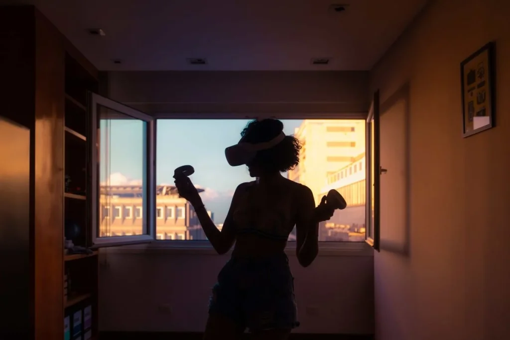 photo of a woman using a virtual reality glasses
