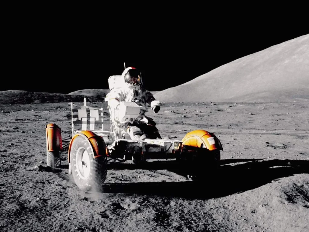 photo of an astronaught on a moon rover