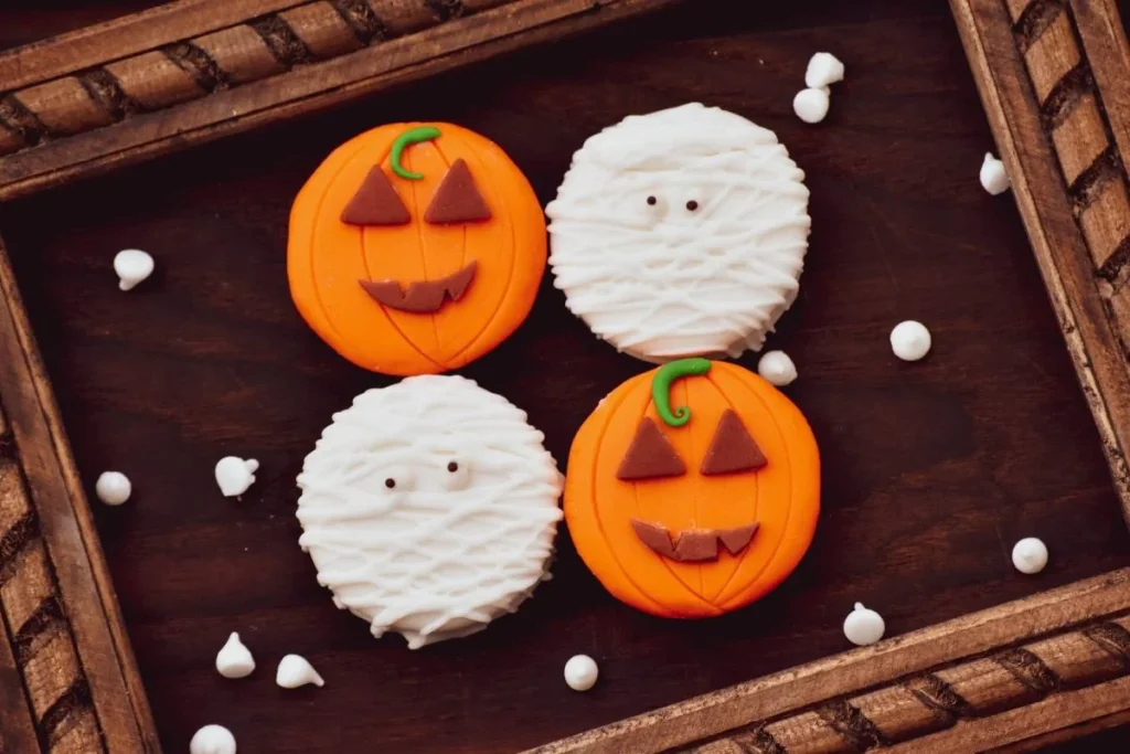 photo of ghost and pumpkin head cookies
