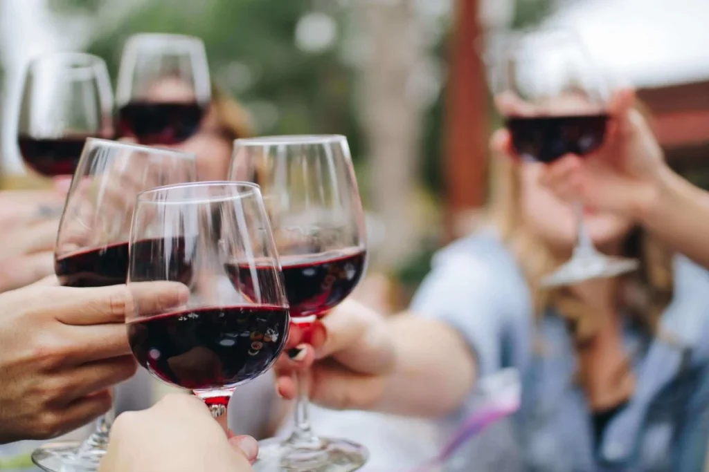 photo of people drinking wine